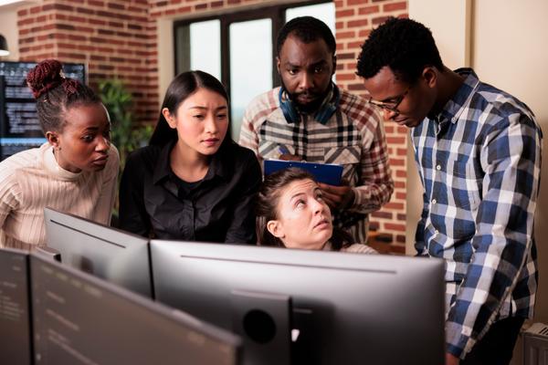 IT Engineers team collaborating on software mission