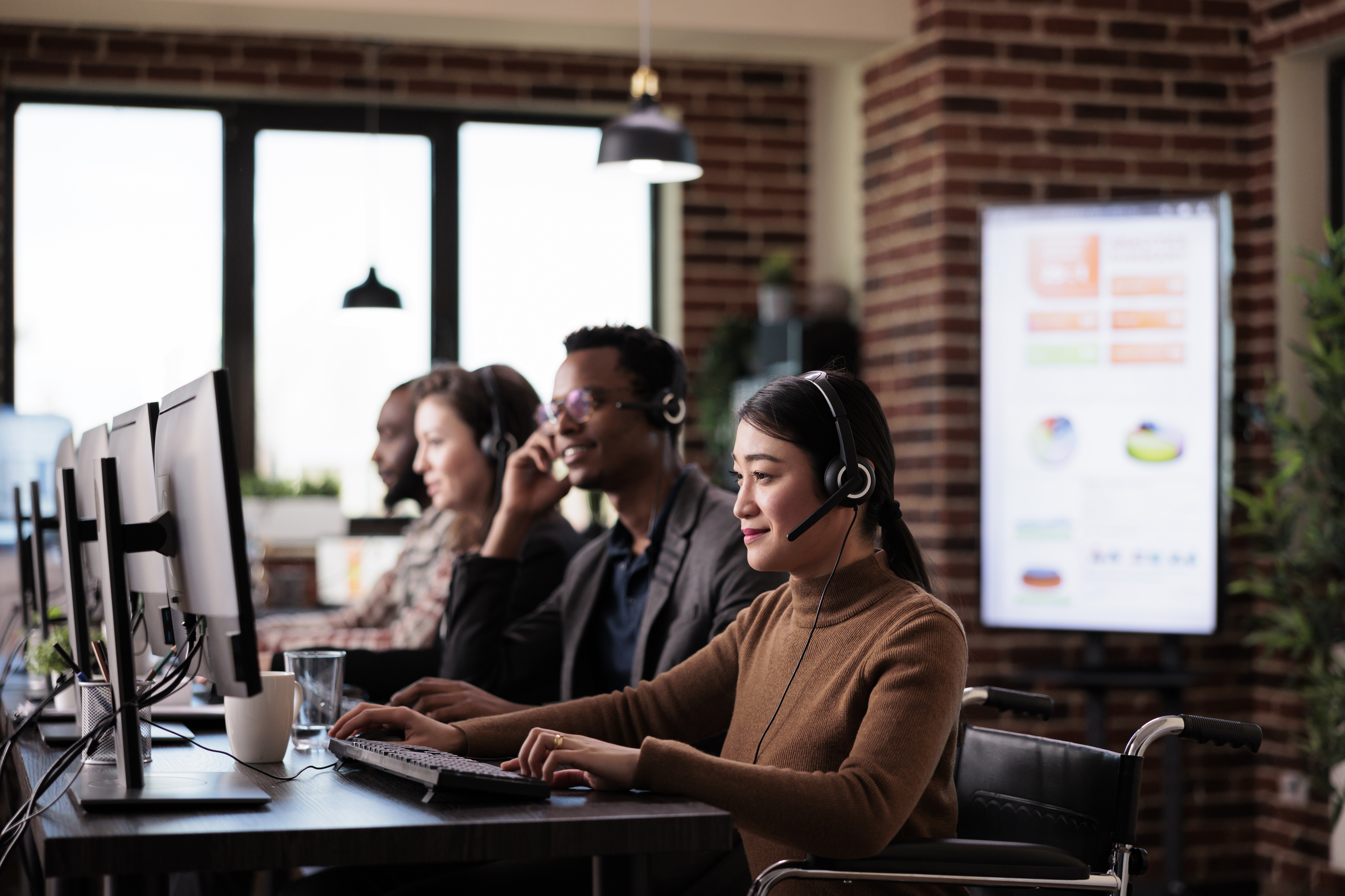 Team reviewing customer data on computer screen